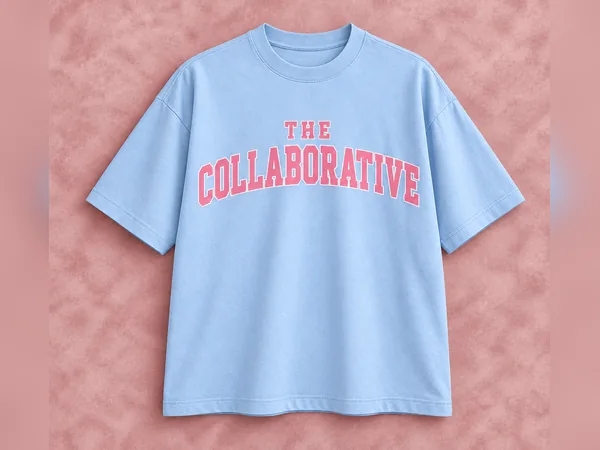 Powder Blue Collaborative Crew Neck Tee Powder Blue Collaborative Crew Neck Tee, short-sleeve crewneck T-shirt with pink The Collaborative collegiate lettering outlined in white